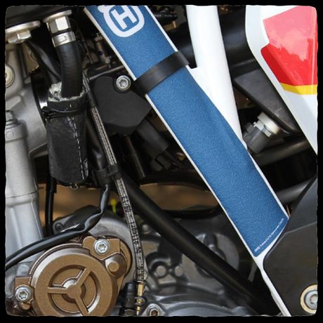DEI Fire Sleeve shown covering Husqvarna fuel line